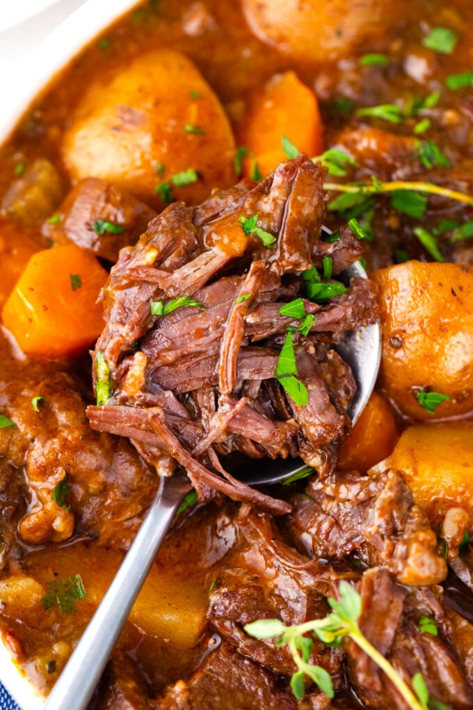Juicy Instant Pot beef Bourguignon with carrots and potatoes.