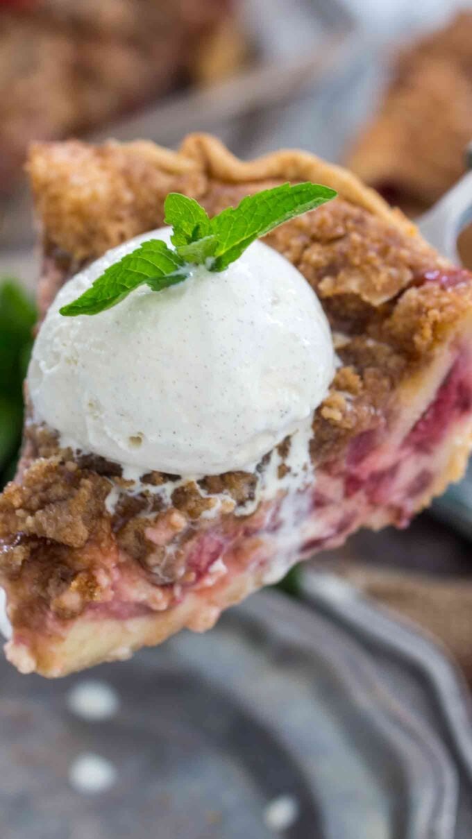 Creamy Strawberry cheesecake Pie slice topped with ice cream