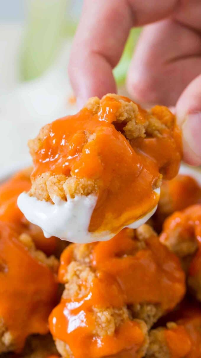 Image of boneless chicken wings with spicy sauce. 