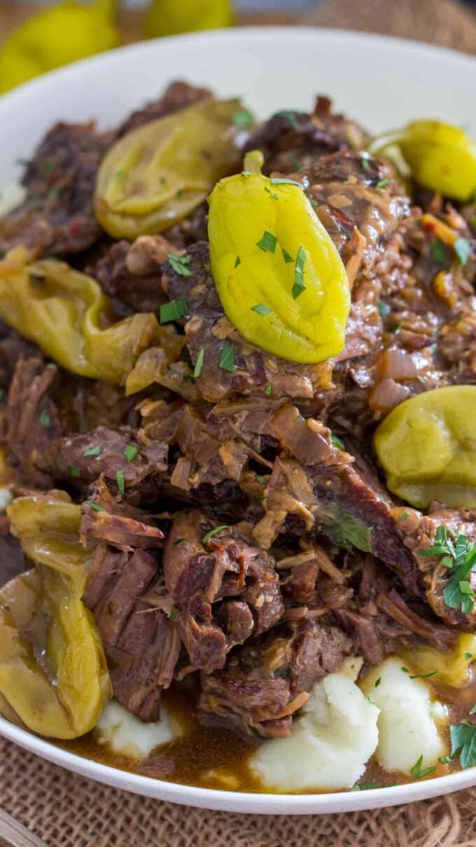 Pressure cooker Mississippi pot roast over mashed potatoes photo. 