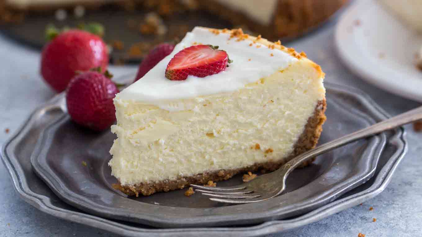 picture of a sliced cheesecake factory original cheesecake on a silver plate