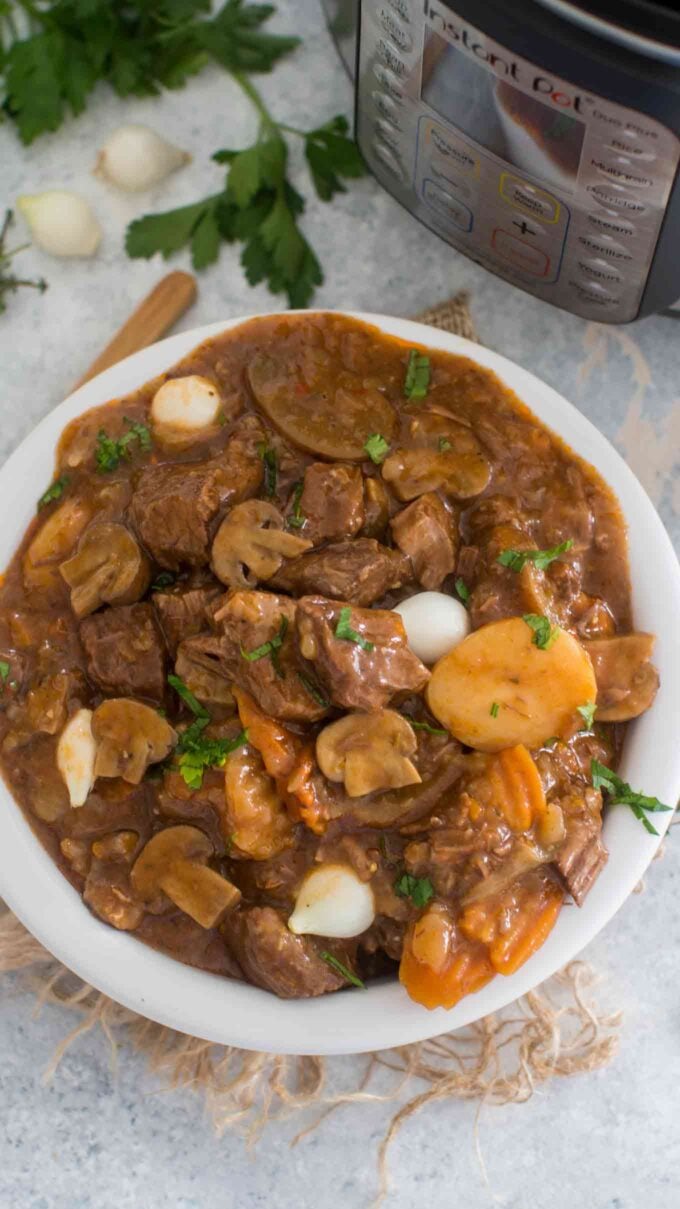 Picture of pressure cooker beef stew with carrots and potatoes.
