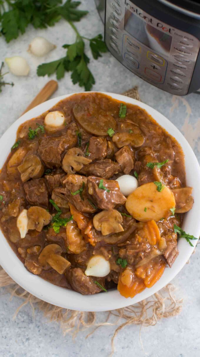 Picture of pressure cooker beef stew with carrots and potatoes. 