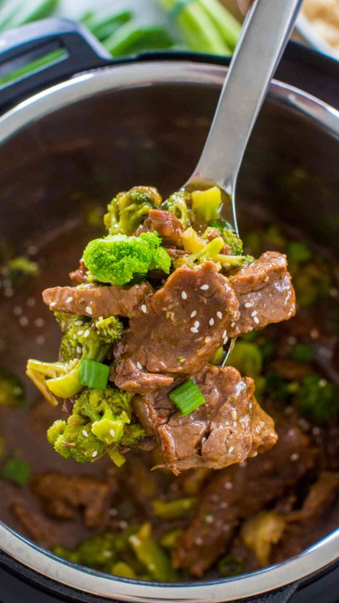 instant pot beef and broccoli on a serving spoon