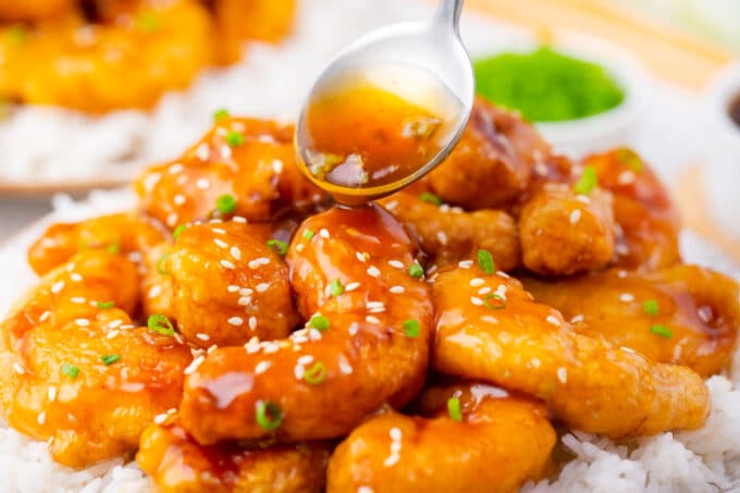 Drizzling honey garlic sticky sauce over PF Chang's crispy honey shrimp.