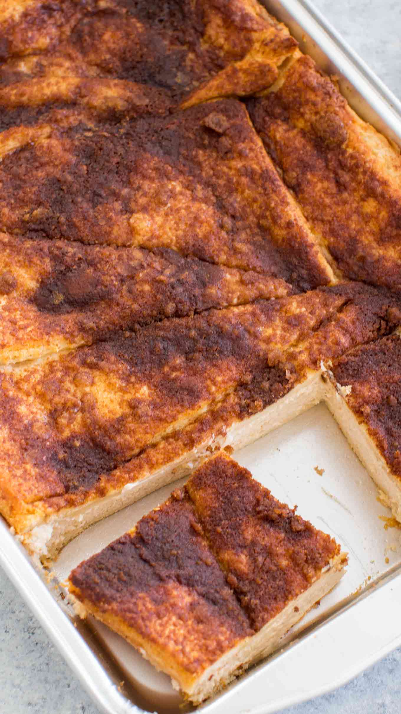 A very simple and delicious Sopapilla Cheesecake Recipe made with a thick layer of cheesecake, in between crescent dough and topped with a cinnamon mixture. Best Sopapilla Cheesecake Recipe