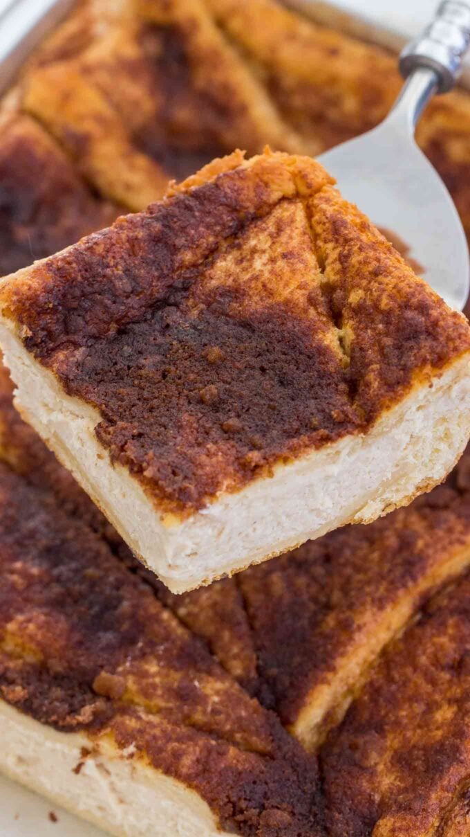 a piece of Homemade sopapilla cheesecake with cinnamon topping on a serving spoon