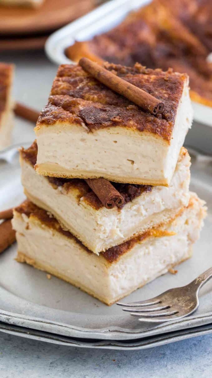 mexican Sopapilla cheesecake slices stacked on top of each other