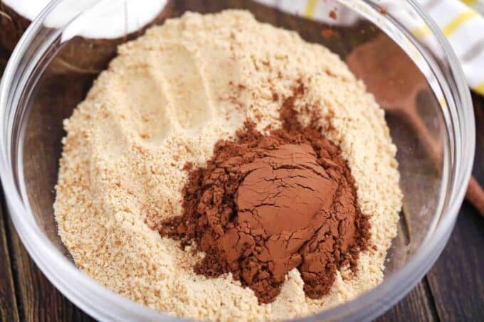 cocoa powder and cookie crumbs in a bowl