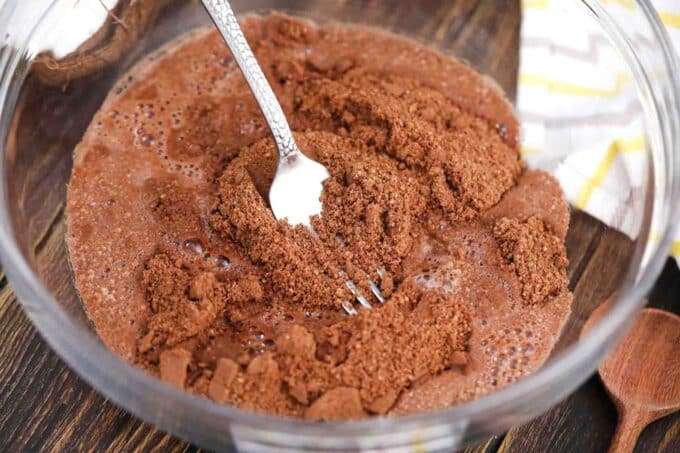 mixing cocoa powder, cookie crumbs, and sugar syrup