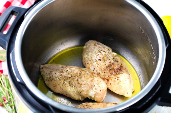 Searing cooked chicken breast in the Instant Pot.