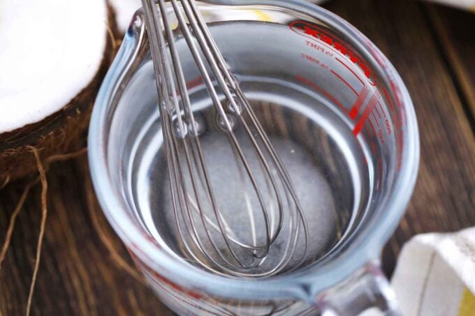 sugar syrup in a measuring cup