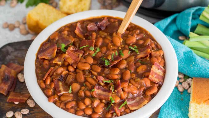 a large bowl of baked beans with bacon