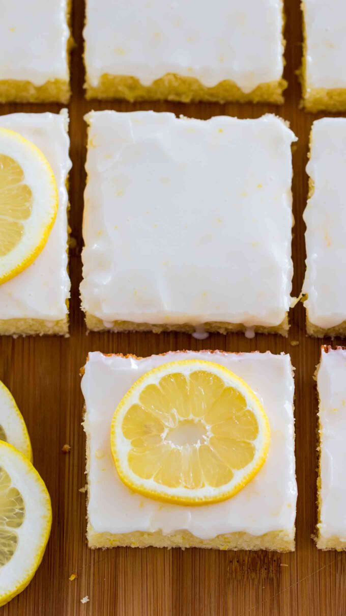 Photo of glazed lemon brownies bars.