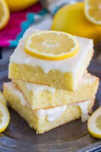 Easy to make One Bowl Lemon Brownies are so buttery and full of fresh lemon flavor. Made with fresh lemon juice, lemon zest and topped with lemon glaze.
