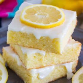 Easy to make One Bowl Lemon Brownies are so buttery and full of fresh lemon flavor. Made with fresh lemon juice, lemon zest and topped with lemon glaze.