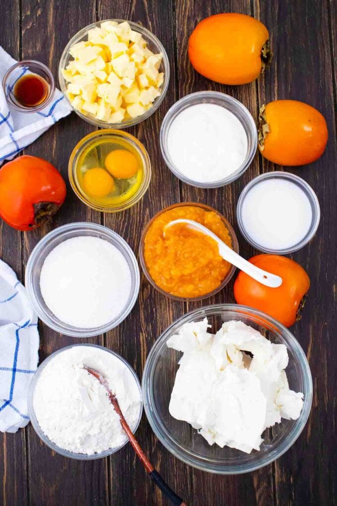 persimmon cheesecake pound cake bars ingredients on a wooden table