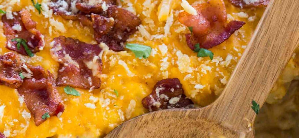 Cheesy Crack Chicken Casserole is the perfect dish to feed a large crowd. Deliciously cheesy and loaded with tender chicken and topped with crispy bacon.