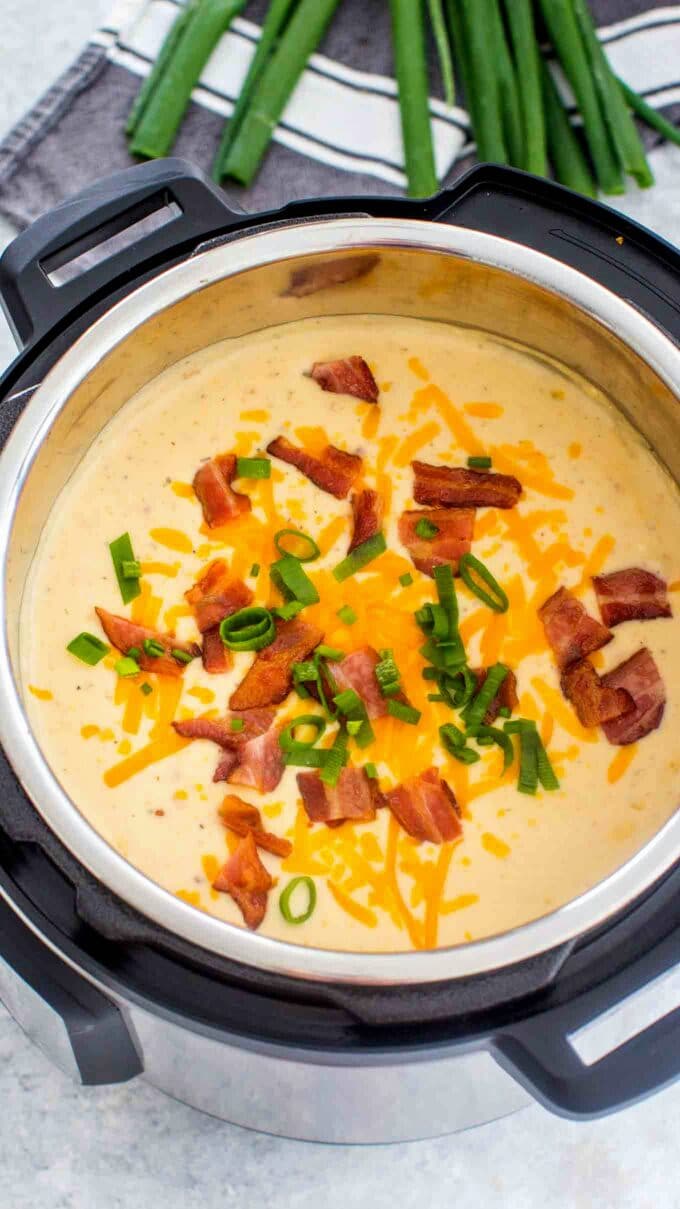 instant pot baked potato soup with cheese and bacon in the pressure cooker