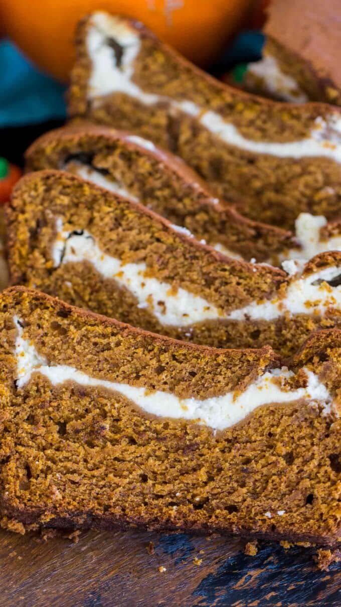 Sliced pumpkin bread filled with cream cheese