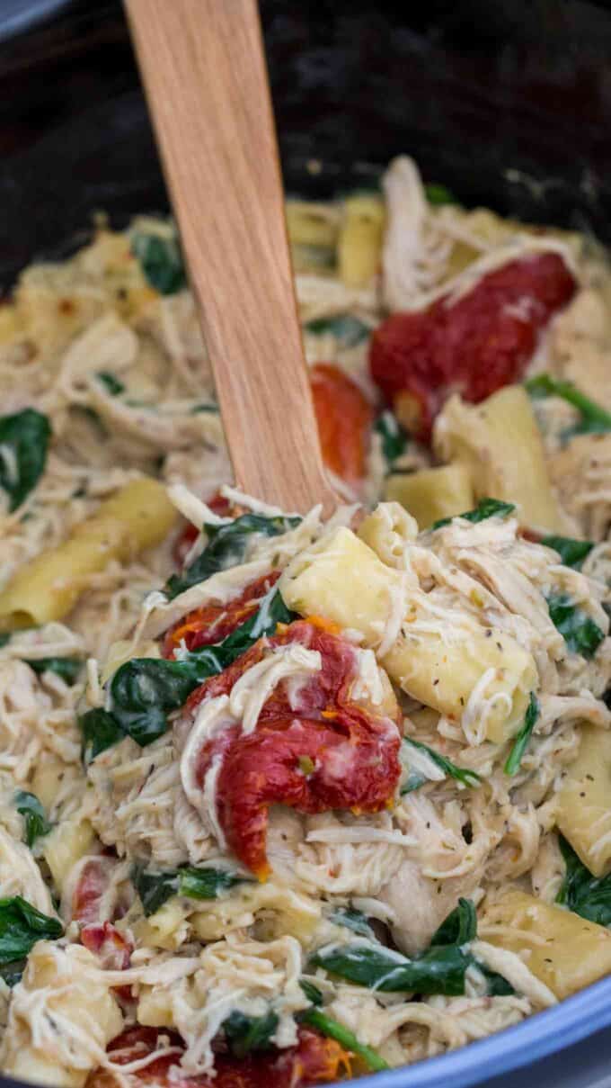 Creamy Tuscan pasta with sun dried tomatoes and cheese in the crockpot