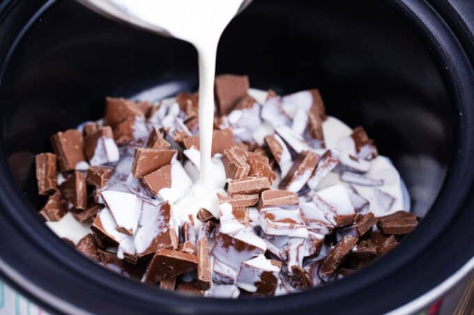 Slow cooker chocolate fondue ingredients in the crockpot.