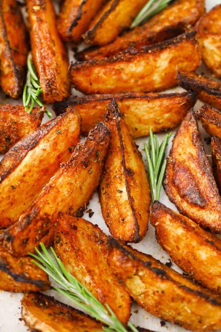 crispy roasted rosemary potatoes on a baking sheet