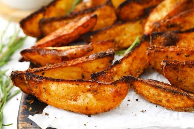 crispy roasted rosemary potatoes on a serving board