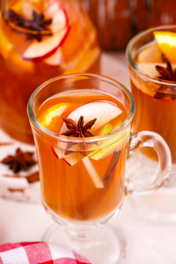 Homemade slow cooker apple cider with spices and pears.