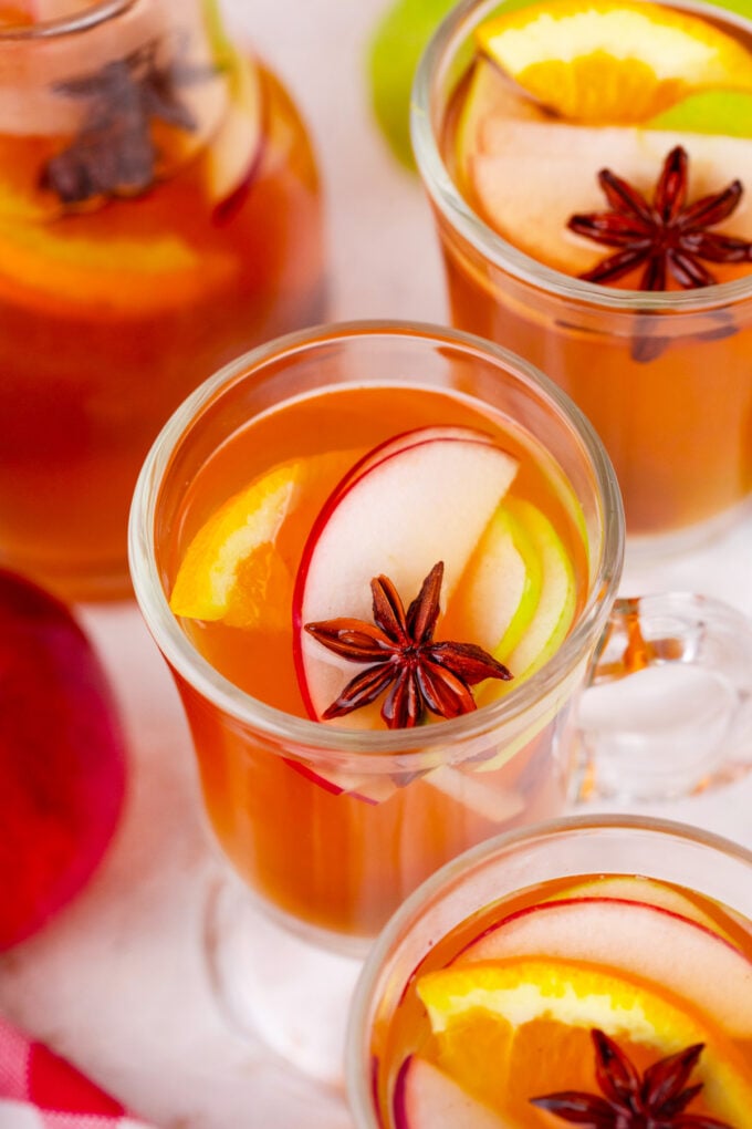 Slow cooker apple cider with spices, pears, and oranges.