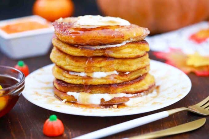a plate of pumpkin cheesecake pancakes