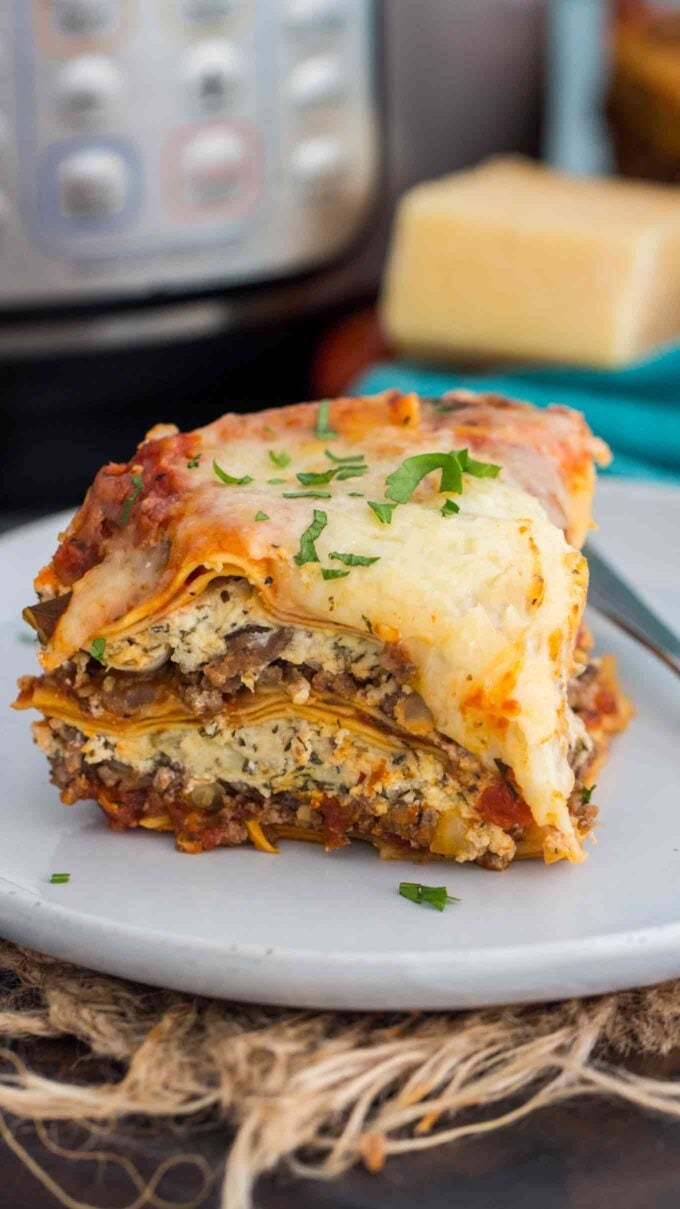 A slice of lasagna cooked in the instant pot on a white plate.