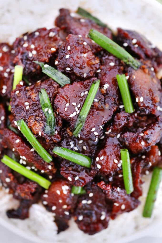 Picture of mongolian beef with green onion and sesame seeds.