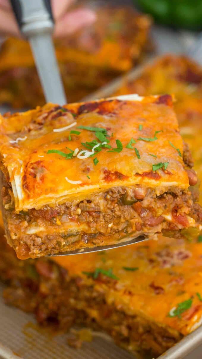 A slice of Taco lasagna on a serving spatula