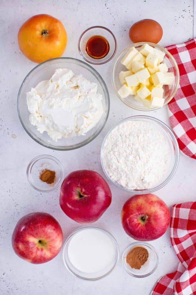 apple pie ingredients in bowls on a table