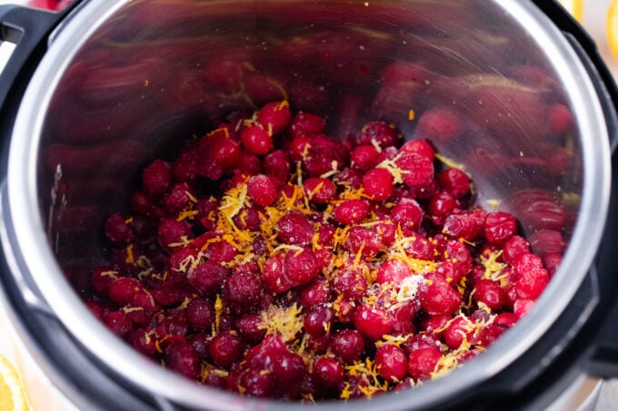 Instant Pot cranberry sauce ingredients in the pressure cooker.