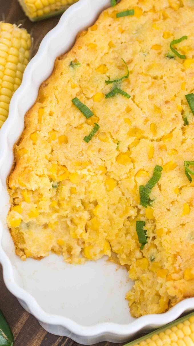 Homemade corn casserole garnished with chopped green onions. 