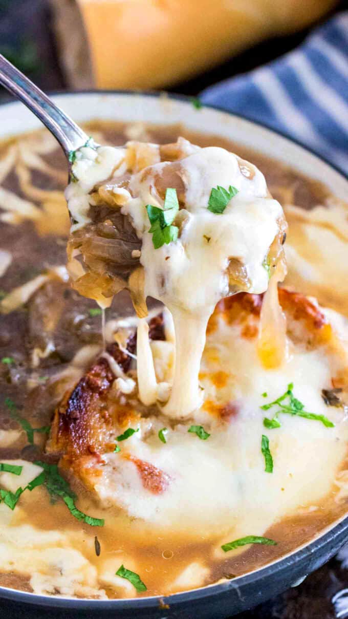 spoonful of french onion soup topped with melted cheese