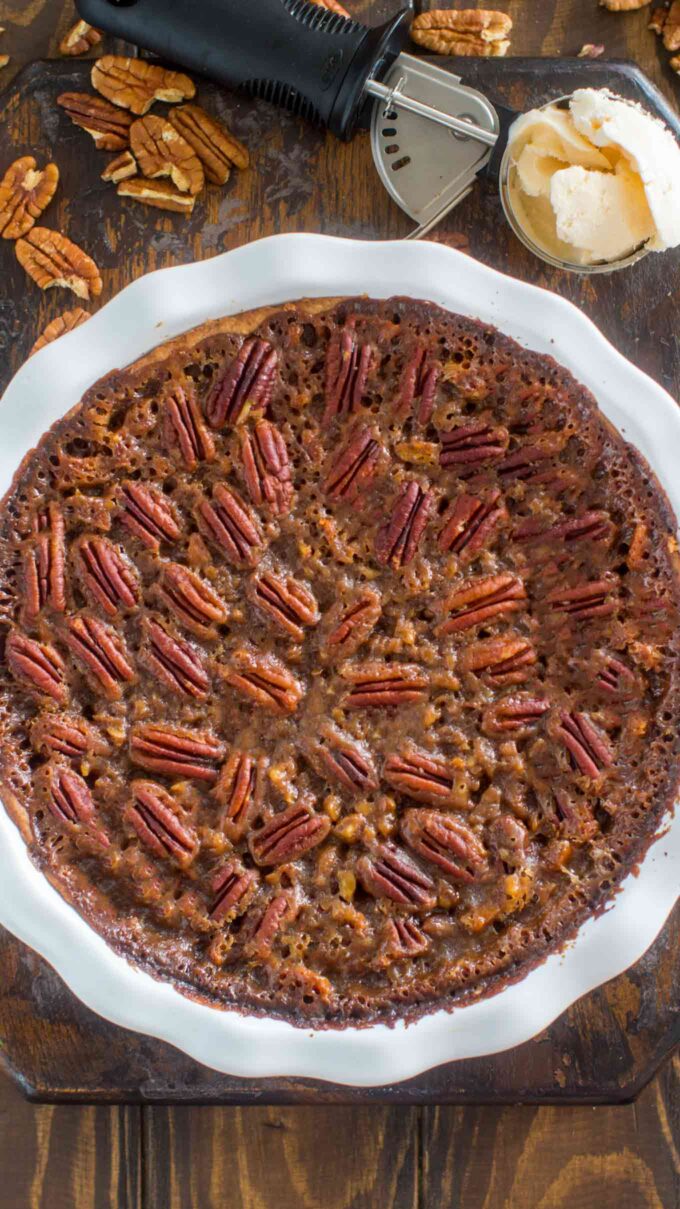 overhead shot of Homemade Pecan Pie with a scoop of ice cream next to it