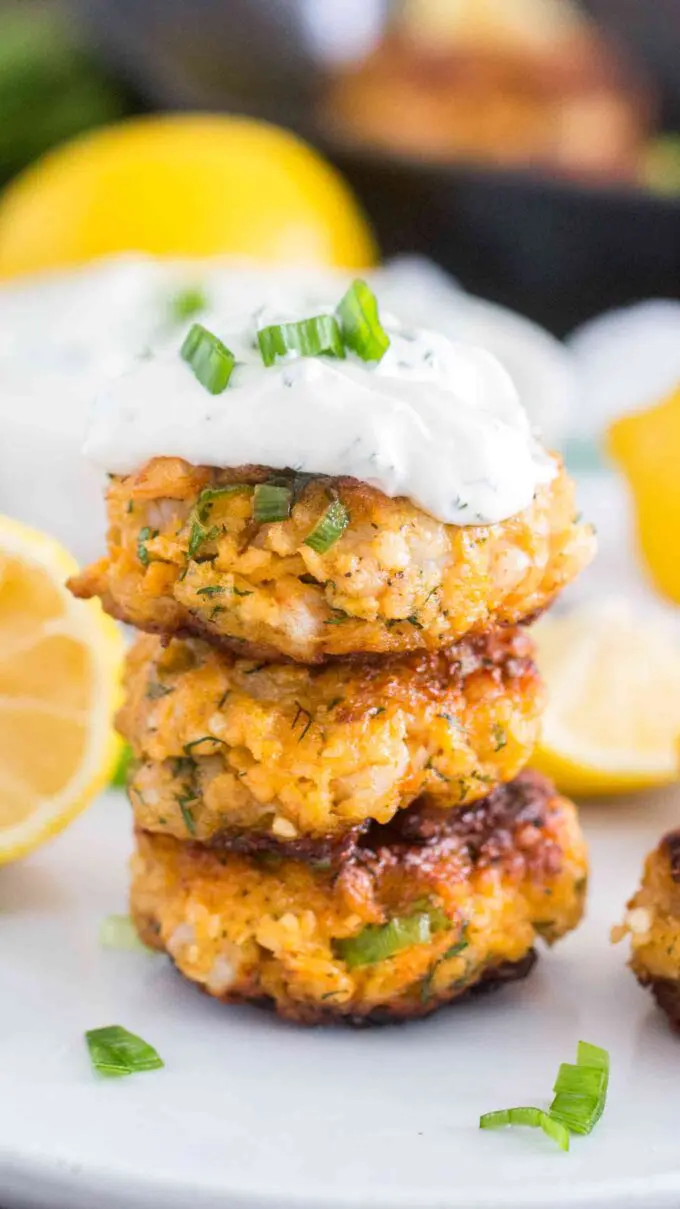 Image of shrimp cakes topped with mayo sauce.