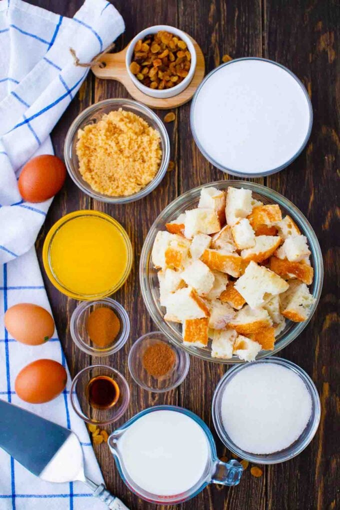 bread pudding ingredients in bowls on a table