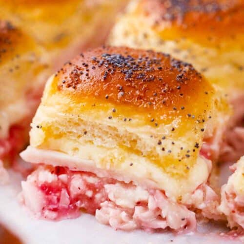 cheesy turkey sliders topped with poppy seeds