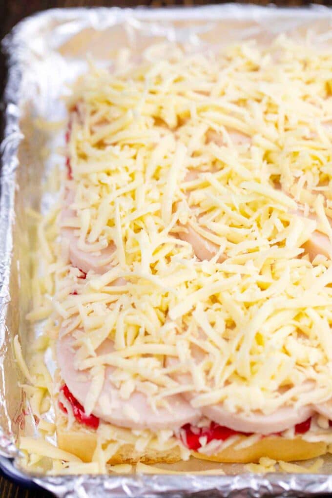 sliced turkey sliced topped with shredded cheese