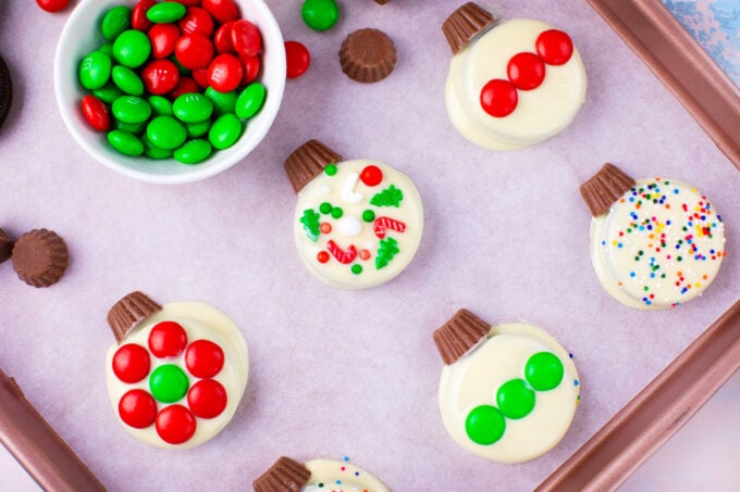 Christmas Oreo ornaments decorated with red and white M&M's.