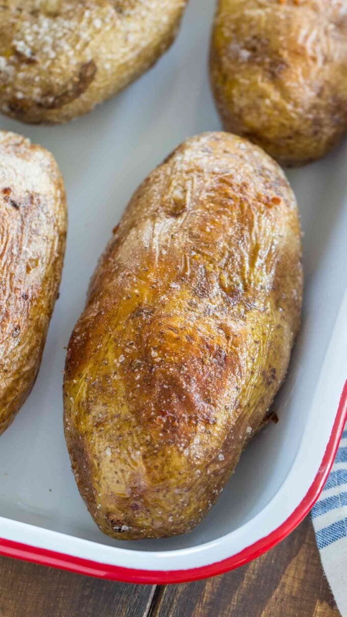 oven roasted potatoes with crispy skin in a casserole dish.