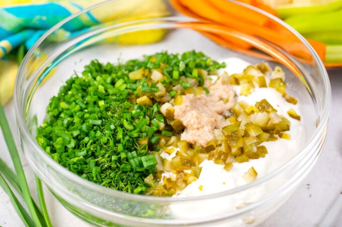 Dill pickle dip ingredients in a bowl.
