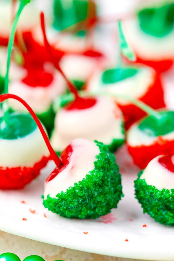 Boozy Maraschino Christmas drunken cherries dipped in white chocolate, red and green sanding sugar.