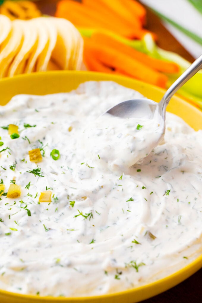 A spoonful of creamy dill pickle dip.