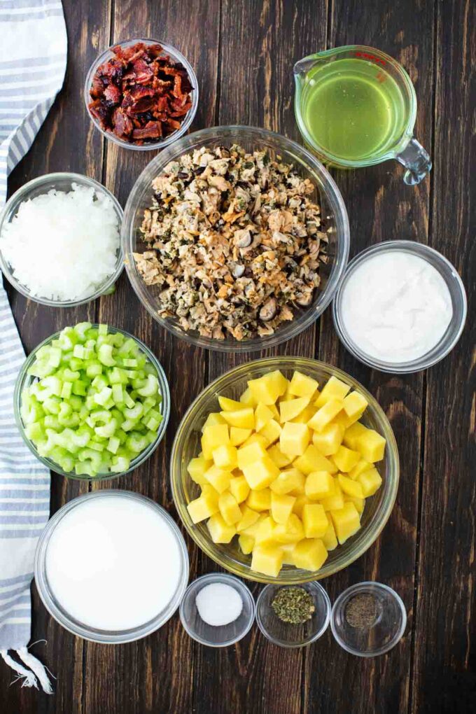 slow cooker clam chowder ingredients in bowls on a tabe