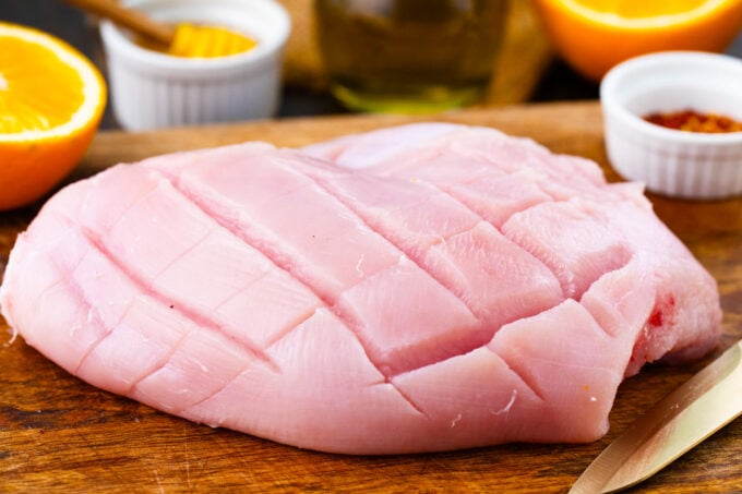 Turkey breast on a cutting board.